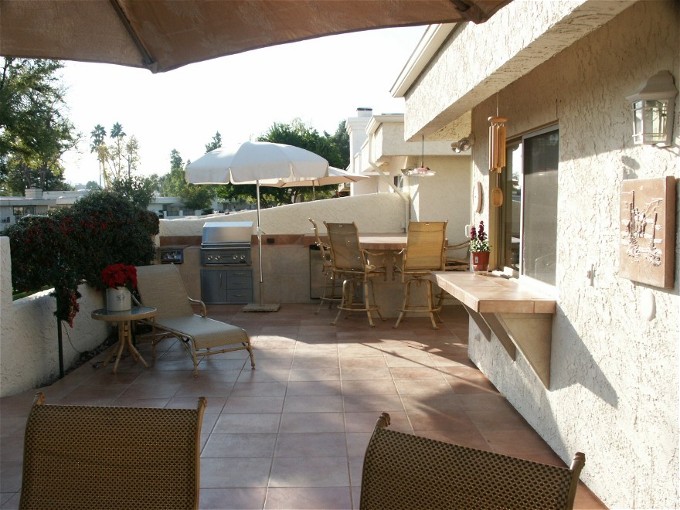 Custom BBQ Island Installation of Outdoor Kitchen and Dining Area